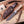 D2 hunting knife with lacewood handle beside handmade Italian leather sheath