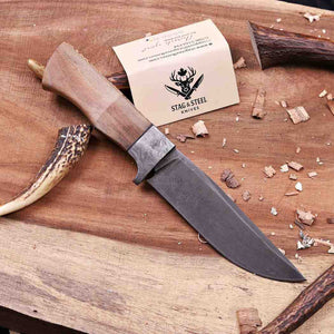 Full profile of D2 semi-tang hunting knife with lacewood handle and Damascus guard