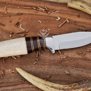 D2 small hunting knife as part of outdoor gear
