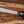 D2 steel machete knife with Grey Micarta handle shown in hand for grip, size, and satin blade detail
