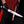 Handmade Expendables 2 toothpick bowie knife held in hand trimming firewood.