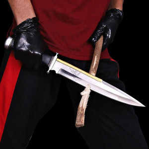 Handmade Expendables 2 toothpick bowie knife held in hand trimming firewood.