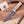 A Stag Steel fixed-blade knife with a dark steel blade and a light brown wood handle, displayed on a wooden surface with wood shavings. The Stag Steel box is visible in the top left corner.
