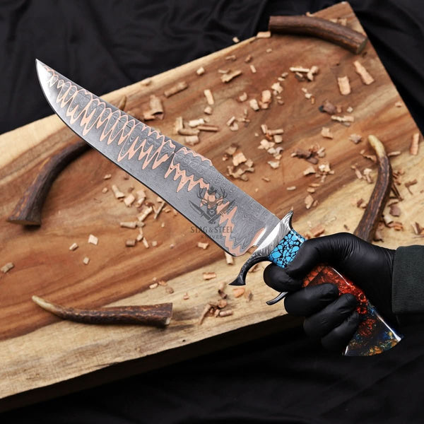 copper damascus bowie knife double guard in hand