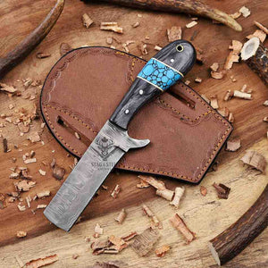 Knife with decorative handle on a wooden surface