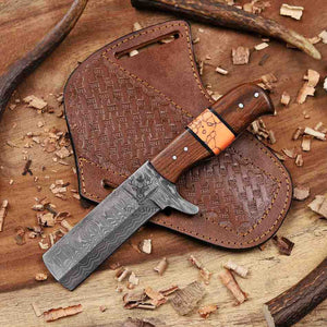 Knife with wooden handle and leather sheath on a wooden surface