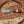 Wooden knife with decorative blade on a wooden surface with wood shavings