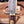 Macro of Damascus guard and sawtooth brass bolster on Iron Mistress bowie knife