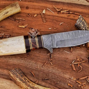 Damascus hunting knife used for camping and hunting