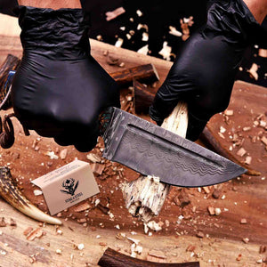 San Mai Damascus hunting knife cutting wood showing working edge