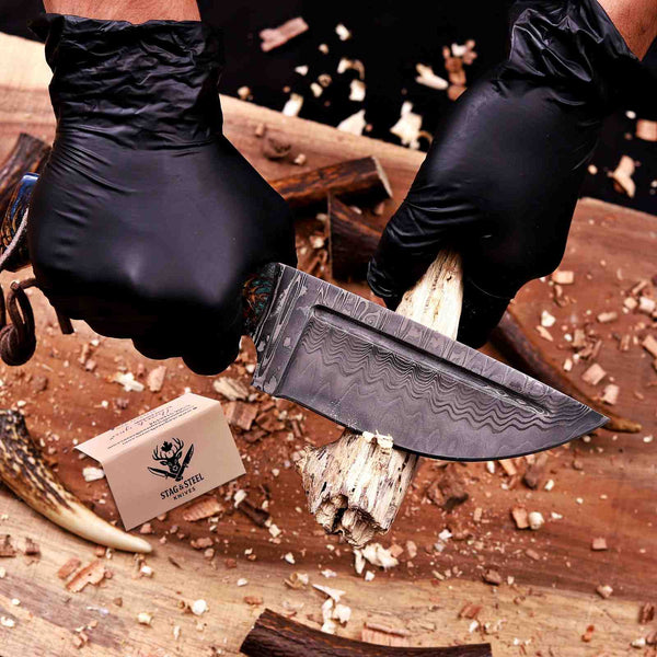 San Mai Damascus hunting knife cutting wood showing working edge