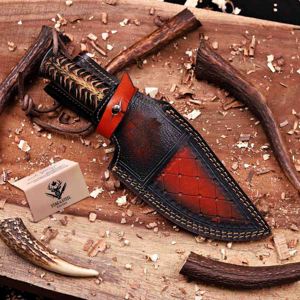Damascus hunting knife with maple leaf engraved leather sheath