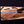 Damascus pommel of bowie knife held in gloved hand