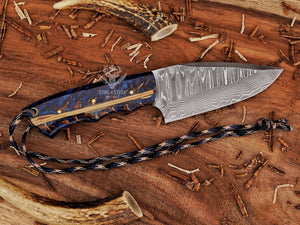 Damascus steel blade on skinning knife