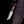 Damascus tanto knife with pine cone handle held in hand