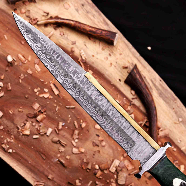 Close-up of VG10 Damascus toothpick blade pattern with brass spine and Damascus guard