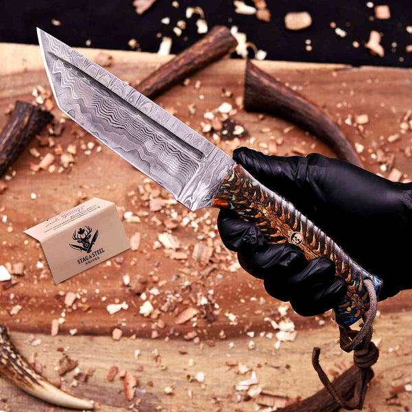 EDC Damascus tanto knife held in gloved hand