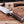 Feather Damascus blade meeting fire pattern guard and antler grip close-up