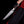 Feather Damascus bowie knife with antler handle held against black background