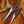 Two hunting knives with leather sheaths on a fur background
