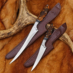 Two hunting knives with leather sheaths on a fur background