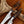 Two knives with wooden handles on a wooden surface