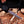 Forged VG10 Damascus bowie blade pattern shown over a cutting of firewood