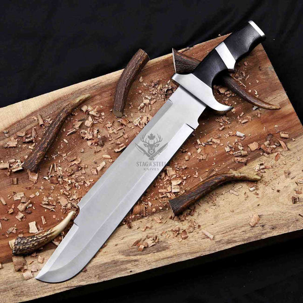 Handmade D2 steel bowie knife with black Micarta handle on rustic wood