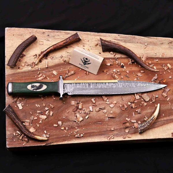 Handmade Damascus toothpick bowie knife with brass spine on wooden board