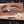 Full profile of handmade Feather Damascus bowie knife with antler handle and wood shavings
