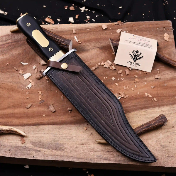 Iron Mistress D2 bowie knife seated in tooled Italian leather sheath with strap