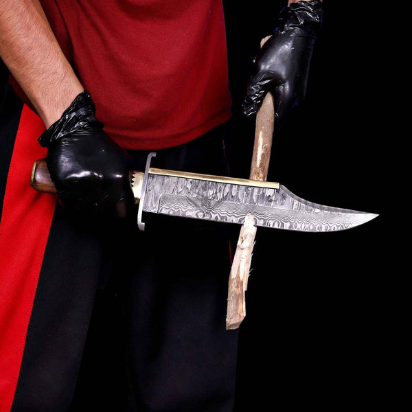 Damascus Iron Mistress bowie knife cutting a wooden branch in strength test