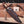 Iron Mistress bowie knife seated in tooled leather sheath with retention strap