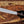 Close-up of Ironwood handle on full tang D2 machete knife with handle pins and lanyard hole