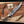 Juan Padillo Damascus Bowie knife with curved clip-point blade beside a Stag Steel branded Care Card