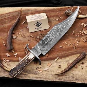 Juan Padillo Damascus Bowie knife with curved clip-point blade beside a Stag Steel branded Care Card
