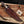 Juan Padillo Damascus Bowie knife in a brown tooled leather sheath beside a Stag Steel branded Care Card