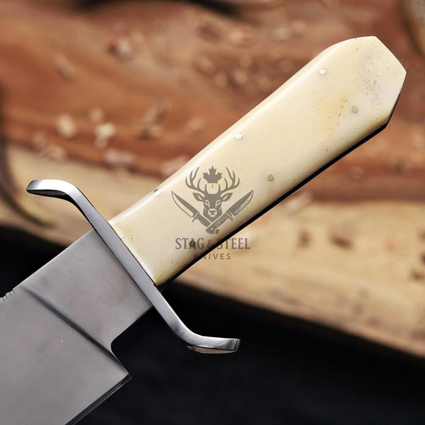 Close-up of the camel bone handle with steel guard and brass pins