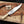 Handmade D2 Bowie knife with camel bone handle and steel guard on a wooden board