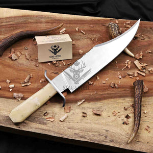Handmade D2 Bowie knife with camel bone handle and steel guard on a wooden board