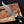  D2 Bowie knife held in a gloved hand, clip-point blade detail