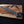 Large handmade Damascus bowie knife held in hand showing full blade