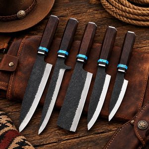 5-piece Damascus steel kitchen knife set with dark wooden handles and blue stone accents on a wooden cutting board