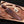 Rambo 3 Bowie Knife In leather sheath on a wooden surface 