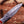 Close-up of real Damascus steel folding knife blade with layered 1095 and 15N20 pattern