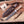 Ridgeback D2 full tang hunting knife with lacewood handle beside embossed leather sheath