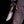 San Mai Damascus hunting knife with pine cone handle held in hand