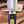 Sawtooth brass bolster and stainless steel guard macro on Iron Mistress bowie knife
