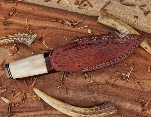 Sharp small Damascus hunting knife with protective leather sheath