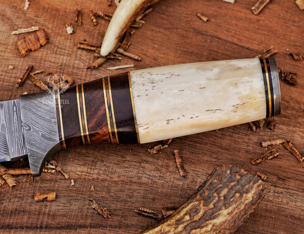 Handle detail of small Damascus hunting knife